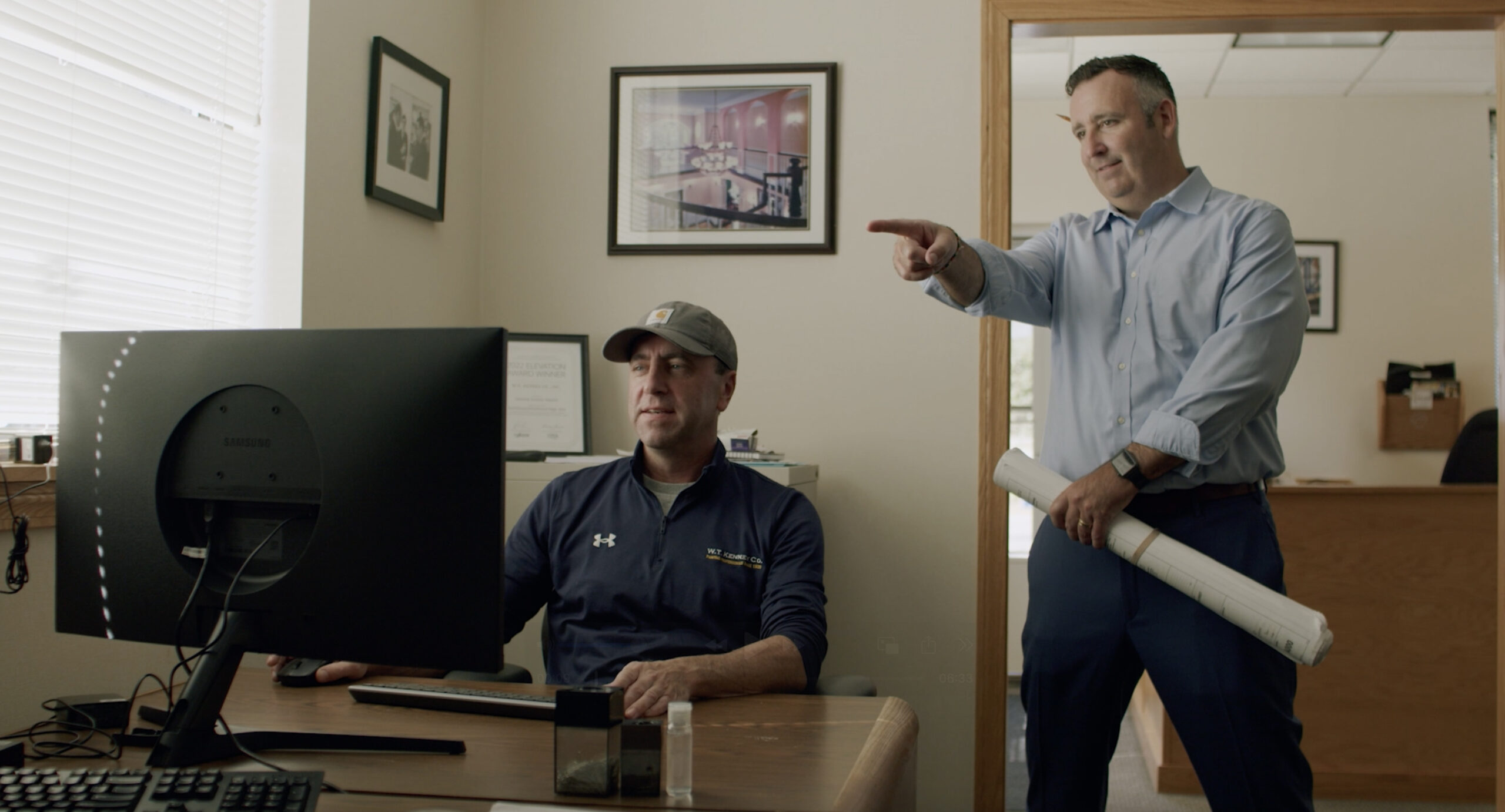 Two construction executives working in an office