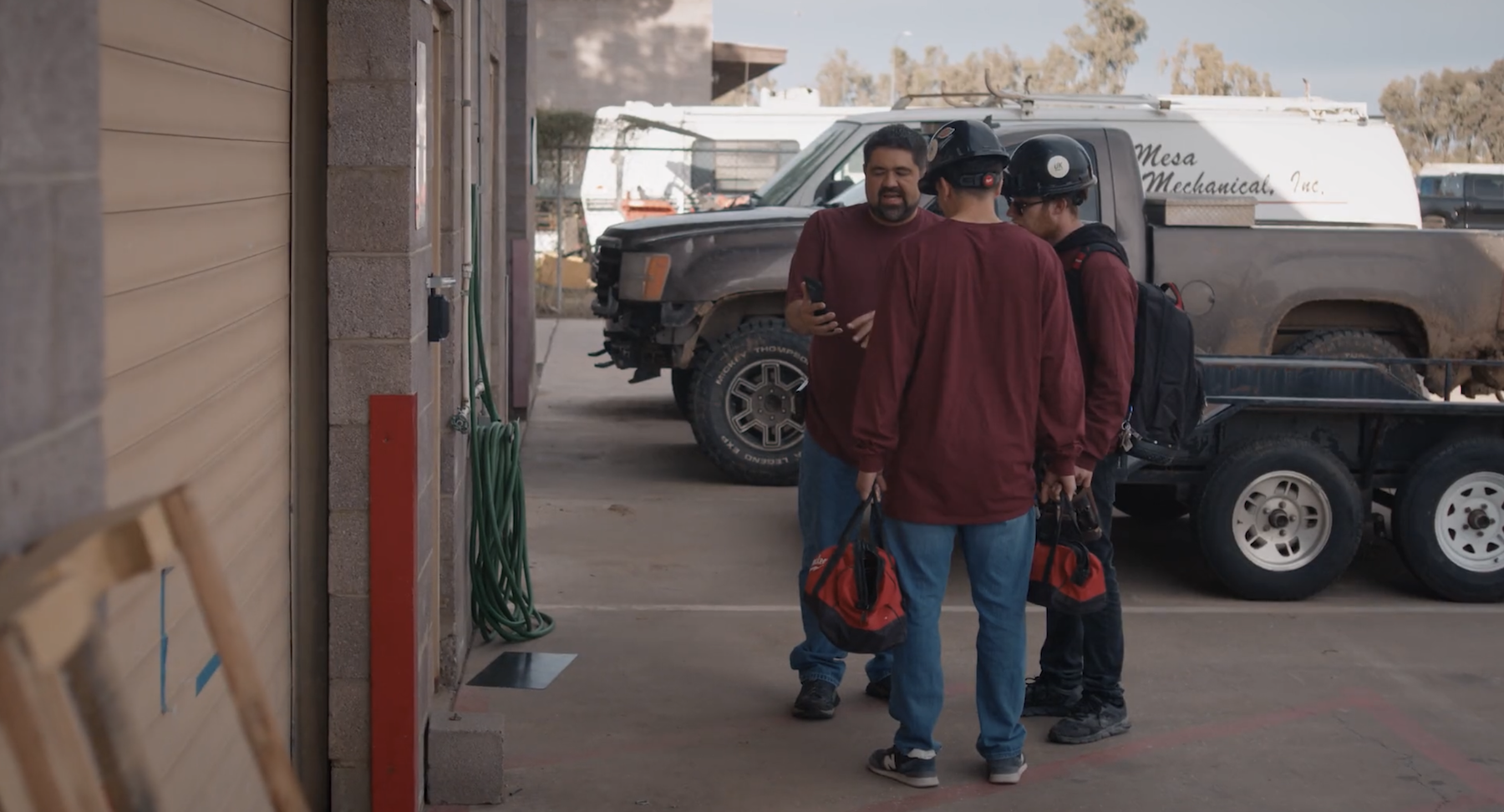 Electrical contractors meeting outside