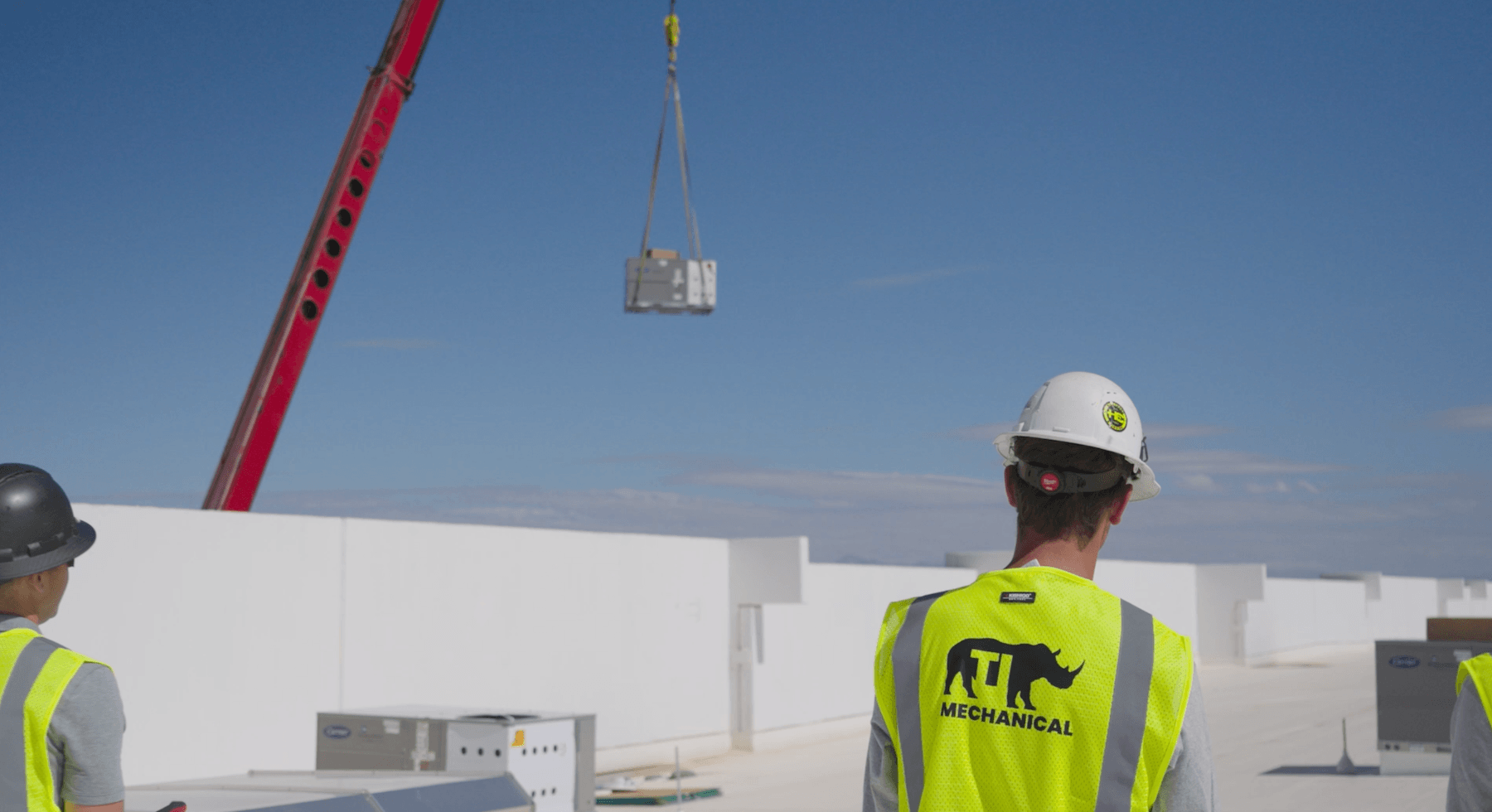 Contractors working on a commercial HVAC job